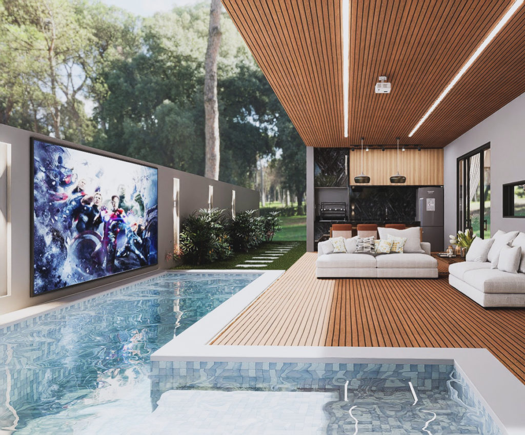 Área de lazer com piscina, deck e living integrado à natureza